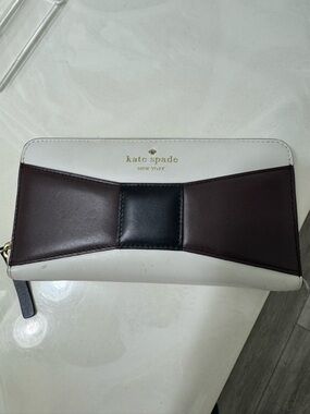 kate spade Ivory Wallet with Brown and Black Bow Accent